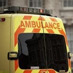 European style ambulance in front of building
