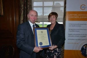 Ian Watson receives his honorary fellowship from Fran Edwards