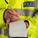 Policeman taking details