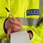 Policeman taking details