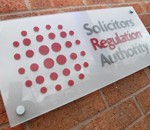 SRA logo on brick wall