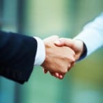 Portrait of hands of business people during a hand shake