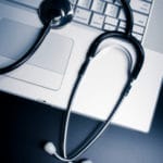 stethoscope on keyboard - medical report