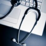 stethoscope on keyboard - medical report