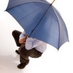 hiding bewind an umbrella